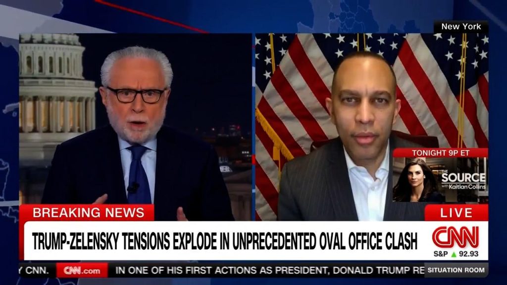 Wolf Blitzer (left) and Leader Jeffries (right) appearing on screen