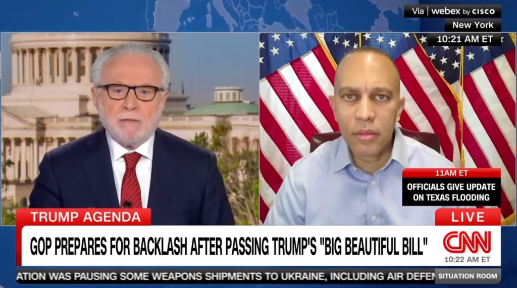 Wolf Blitzer (left) and Leader Jeffries (right) appearing on screen