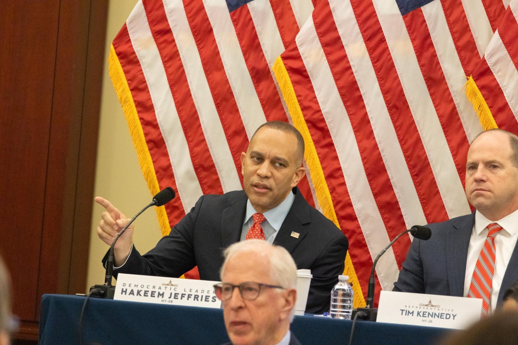 Leader Jeffries seated at dais and speaking at Steering and Policy Committee Hearing
